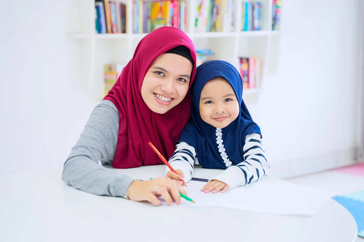 Dedicated female Quran tutor teaching a young girl student at Quran Janan Academy